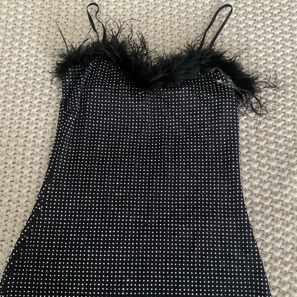 Black shiny sparkly and has feathers skin tight dress, really cute for parties - Picture 1 of 2